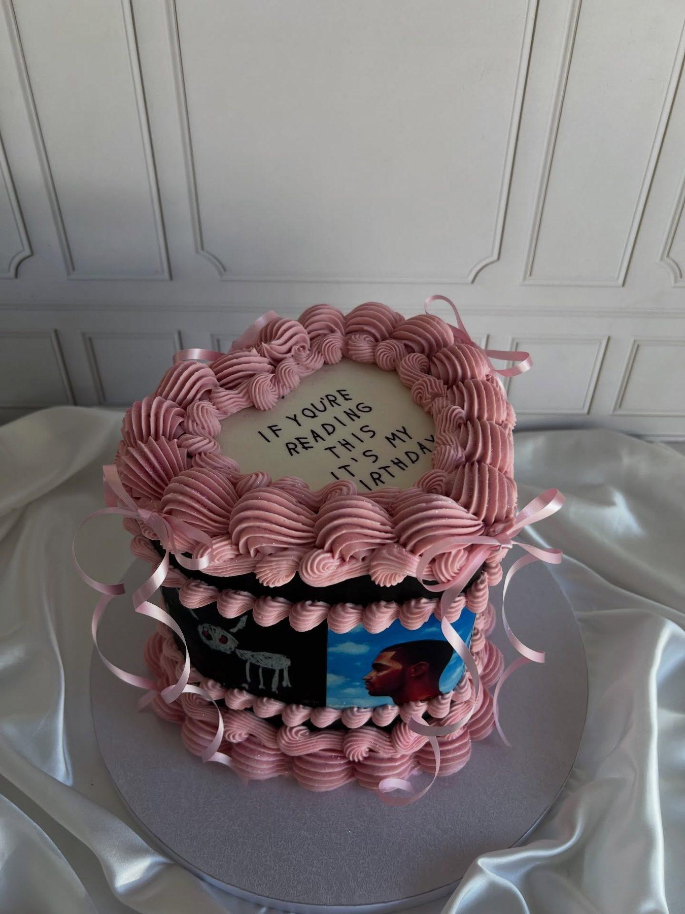 Two-tier birthday cake decorated with a record/album theme